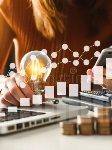 business-hand-holding-lightbulb-using-laptop-computer-money-stack-office-idea-saving-energy-accounting-finance-concept-139238194